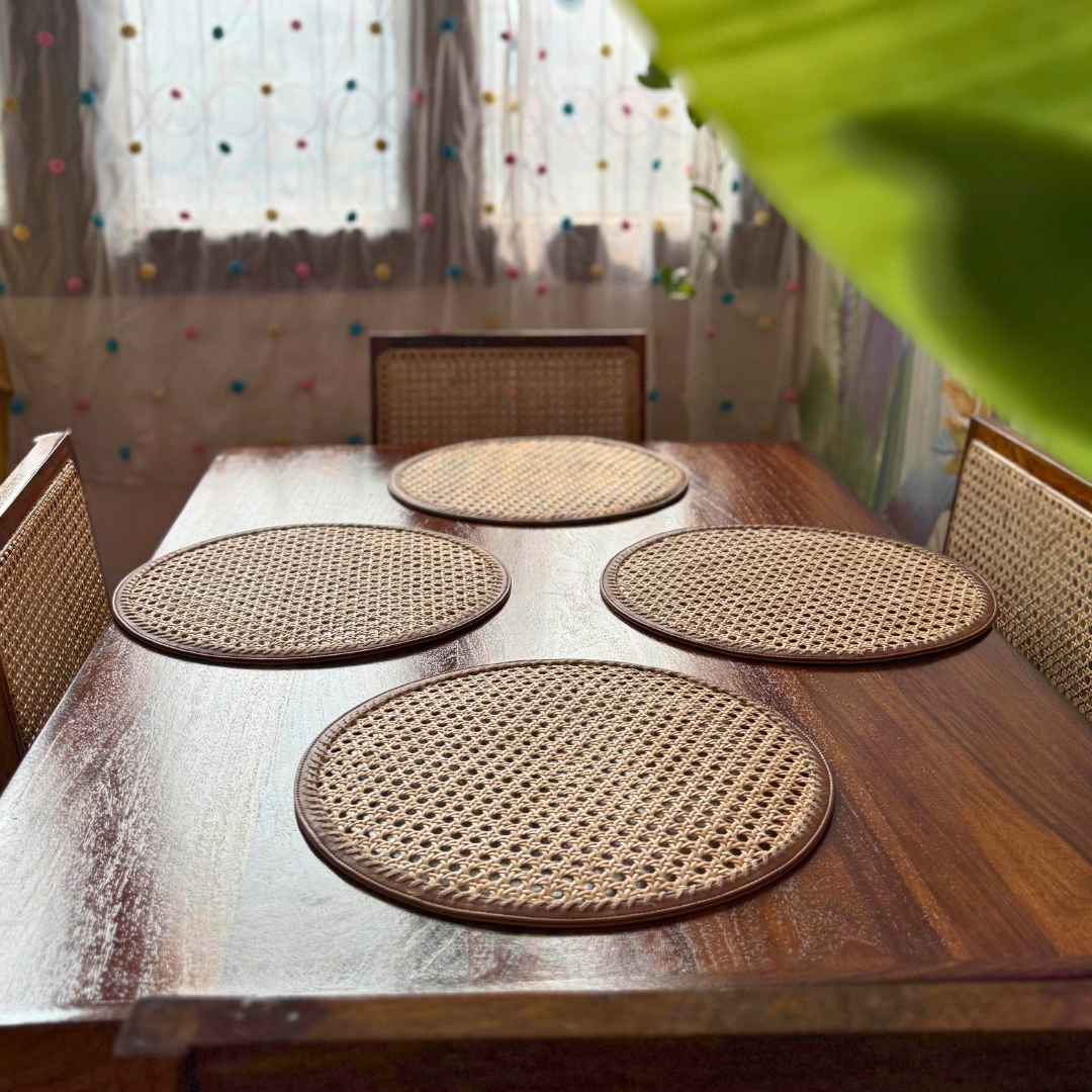 "Durable woven rattan table mat in round shape for kitchen use"
"Stylish round rattan placemats for modern dining table